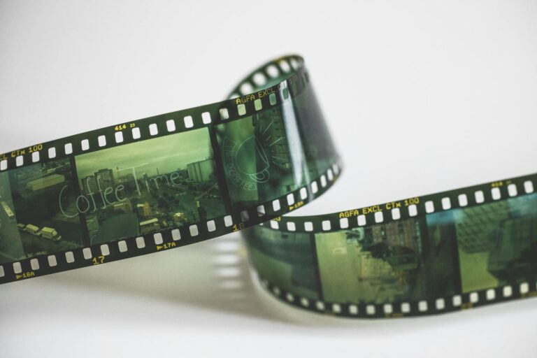Close-up of a vintage AGFA filmstrip with cinematic exposures, evoking nostalgia.